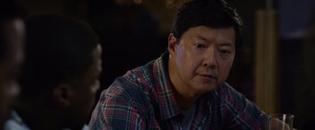 Movie still from “Ride Along 2” (2016), directed by Tim Story – A person wearing a plaid shirt; Close Up shot, Over the shoulder angle