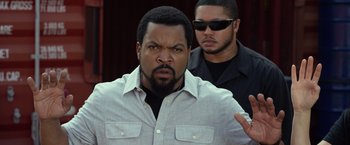Movie still from “Ride Along 2” (2016), directed by Tim Story – A man with a beard and a man with a mustache; Close Up shot, Over the shoulder angle
