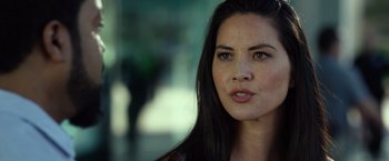 Movie still from “Ride Along 2” (2016), directed by Tim Story – A woman's face in a blurry background; Close Up shot, Over the shoulder angle