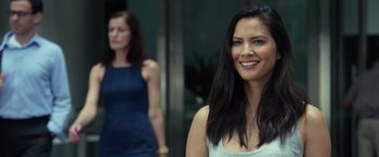 Movie still from “Ride Along 2” (2016), directed by Tim Story – A woman standing next to another woman in front of a building; Close Up shot, Over the shoulder angle