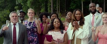 Movie still from “Ride Along 2” (2016), directed by Tim Story – A group of women standing next to each other holding wine glasses; Medium shot, Low angle