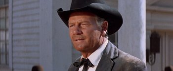 Movie still from “Ride the High Country” (1962), directed by Sam Peckinpah – An older man wearing a cowboy hat and a suit; Close Up shot, Low angle