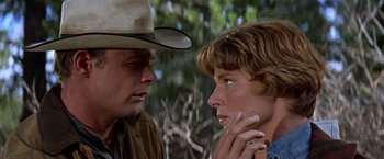 Movie still from “Ride the High Country” (1962), directed by Sam Peckinpah – A man and a woman talking to each other; Close Up shot, Low angle