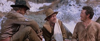 Movie still from “Ride the High Country” (1962), directed by Sam Peckinpah – A man with a hat and a towel around his neck; Medium shot, Low angle