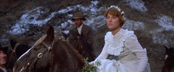 Movie still from “Ride the High Country” (1962), directed by Sam Peckinpah – A man and a woman on a horse; Close Up shot, Low angle
