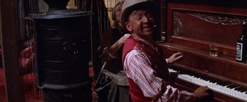 Movie still from “Ride the High Country” (1962), directed by Sam Peckinpah – An old man with a hat and a cigarette in his mouth; Close Up shot, High angle
