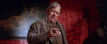 Movie still from “Ride the High Country” (1962), directed by Sam Peckinpah – An older man wearing a suit and a tie; Close Up shot, Low angle