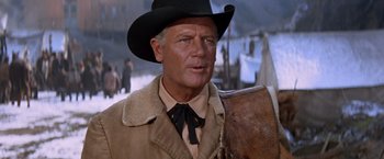 Movie still from “Ride the High Country” (1962), directed by Sam Peckinpah – An older man wearing a cowboy hat while holding an axe; Close Up shot, Low angle