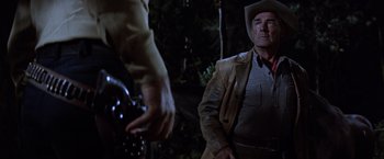 Movie still from “Ride the High Country” (1962), directed by Sam Peckinpah – A man wearing a cowboy hat and a leather jacket; Medium shot, Low angle