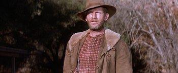 Movie still from “Ride the High Country” (1962), directed by Sam Peckinpah – A man in a hat and a brown jacket; Medium shot, Low angle