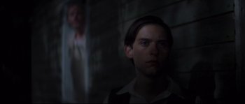 Movie still from “Ride with the Devil” (1999), directed by Ang Lee – A man standing next to another man in a dark room; Close Up shot, Low angle
