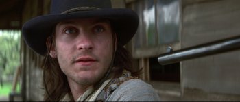 Movie still from “Ride with the Devil” (1999), directed by Ang Lee – A person wearing a hat; Close Up shot, Low angle