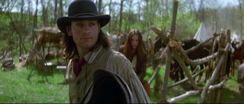 Movie still from “Ride with the Devil” (1999), directed by Ang Lee – A man and a woman in the woods with trees in the background; Medium shot, Over the shoulder angle