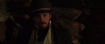 Movie still from “Ride with the Devil” (1999), directed by Ang Lee – A person wearing a hat; Close Up shot, Over the shoulder angle
