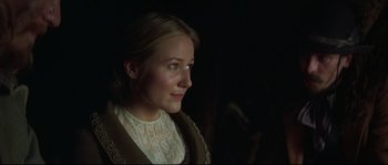 Movie still from “Ride with the Devil” (1999), directed by Ang Lee – A woman in a white shirt is looking at the camera; Close Up shot, Over the shoulder angle