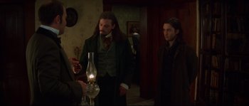 Movie still from “Ride with the Devil” (1999), directed by Ang Lee – Two men standing next to each other in a room; Medium shot, Over the shoulder angle