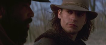 Movie still from “Ride with the Devil” (1999), directed by Ang Lee – A person wearing a hat; Close Up shot, Over the shoulder angle