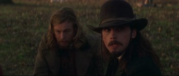 Movie still from “Ride with the Devil” (1999), directed by Ang Lee – A man in a hat and a man with long hair; Close Up shot, Over the shoulder angle