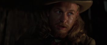 Movie still from “Ride with the Devil” (1999), directed by Ang Lee – A person with long hair; Close Up shot, Over the shoulder angle
