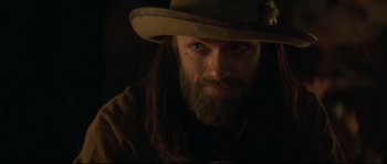 Movie still from “Ride with the Devil” (1999), directed by Ang Lee – A person wearing a hat; Close Up shot, Over the shoulder angle