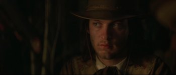 Movie still from “Ride with the Devil” (1999), directed by Ang Lee – A person wearing a hat; Close Up shot, Over the shoulder angle