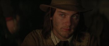 Movie still from “Ride with the Devil” (1999), directed by Ang Lee – A person wearing a hat; Close Up shot, Over the shoulder angle