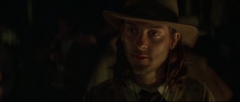 Movie still from “Ride with the Devil” (1999), directed by Ang Lee – A person wearing a hat; Close Up shot, Over the shoulder angle