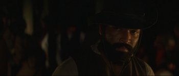 Movie still from “Ride with the Devil” (1999), directed by Ang Lee – A man with a beard wearing a black hat; Close Up shot, Over the shoulder angle