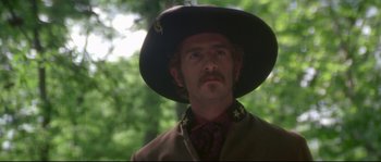 Movie still from “Ride with the Devil” (1999), directed by Ang Lee – A person wearing a hat; Close Up shot, Low angle