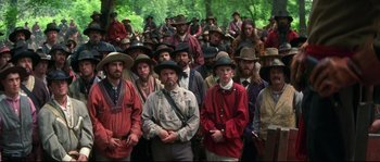Movie still from “Ride with the Devil” (1999), directed by Ang Lee – A large group of men in hats and jackets; Wide shot, High angle