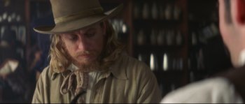 Movie still from “Ride with the Devil” (1999), directed by Ang Lee – A person wearing a hat; Close Up shot, Over the shoulder angle