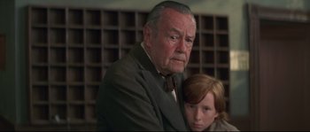 Movie still from “Ride with the Devil” (1999), directed by Ang Lee – An older man and a young boy are looking at the camera; Medium shot, Low angle
