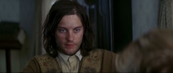 Movie still from “Ride with the Devil” (1999), directed by Ang Lee – A person with long dark hair; Close Up shot, Over the shoulder angle