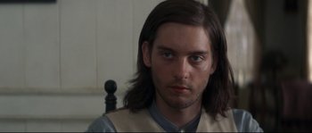 Movie still from “Ride with the Devil” (1999), directed by Ang Lee – A person with long brown hair; Close Up shot, Over the shoulder angle