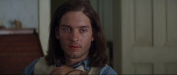 Movie still from “Ride with the Devil” (1999), directed by Ang Lee – A person with long brown hair; Close Up shot, Over the shoulder angle