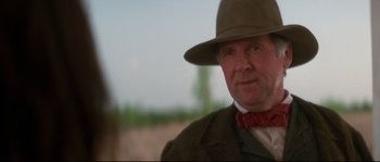 Movie still from “Ride with the Devil” (1999), directed by Ang Lee – A man wearing a hat and a bow tie; Close Up shot, Low angle