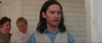 Movie still from “Ride with the Devil” (1999), directed by Ang Lee – A person with long brown hair; Close Up shot, Low angle