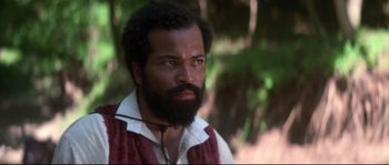 Movie still from “Ride with the Devil” (1999), directed by Ang Lee – A man with a beard is looking into the distance; Close Up shot, Low angle