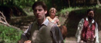 Movie still from “Ride with the Devil” (1999), directed by Ang Lee – A man and a woman are walking through the woods; Close Up shot, Over the shoulder angle