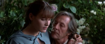 Movie still from “Ridicule” (1996), directed by Patrice Leconte – A man and a woman looking at each other; Close Up shot, Over the shoulder angle