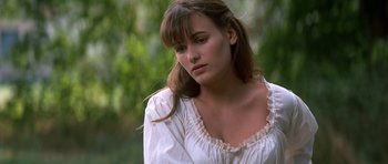 Movie still from “Ridicule” (1996), directed by Patrice Leconte – A beautiful young lady wearing a white shirt; Close Up shot, Over the shoulder angle