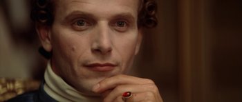 Movie still from “Ridicule” (1996), directed by Patrice Leconte – A person wearing a ring; Close Up shot, Low angle