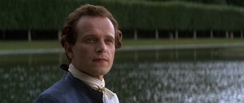 Movie still from “Ridicule” (1996), directed by Patrice Leconte – A person near a body of water; Close Up shot, Low angle