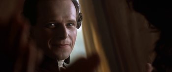 Movie still from “Ridicule” (1996), directed by Patrice Leconte – A man's face in front of a window; Close Up shot, Over the shoulder angle