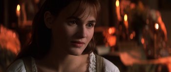 Movie still from “Ridicule” (1996), directed by Patrice Leconte – A person wearing a white shirt; Close Up shot, Over the shoulder angle