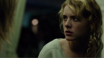 Movie still from “Rings” (2017), directed by F. Javier Gutiérrez – A person with blonde hair; Close Up shot, Low angle