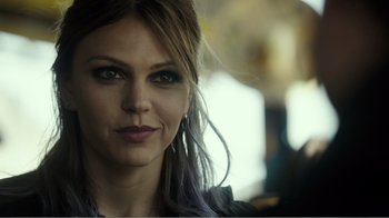 Movie still from “Rings” (2017), directed by F. Javier Gutiérrez – A person with purple hair; Close Up shot, Over the shoulder angle