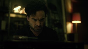 Movie still from “Rings” (2017), directed by F. Javier Gutiérrez – A person sitting in front of a computer; Close Up shot, High angle