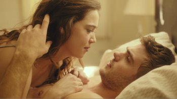 Movie still from “Rings” (2017), directed by F. Javier Gutiérrez – A man and a woman laying in a bed; Close Up shot, Over the shoulder angle