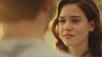 Movie still from “Rings” (2017), directed by F. Javier Gutiérrez – A young woman looking at a man in front of a mirror; Close Up shot, Over the shoulder angle